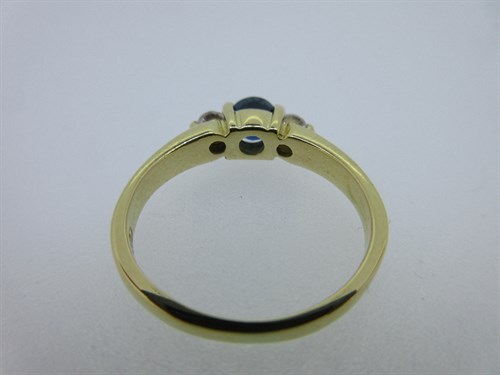 Lot 431 - An 18ct gold sapphire and diamond three stone ring by Cellini and an 18ct gold wedding band