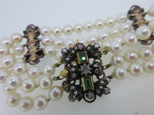 Lot 341 - A three row cultured pearl bracelet with 18th...