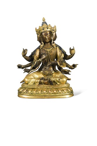 Lot 429 - A Chinese gilt bronze multi-headed and multi-armed seated Avalokitesvara