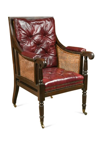 Lot 677 - A caned mahogany bergère library armchair, 19th century