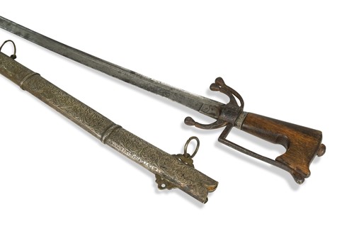 Lot 441 - A North African rhinoceros horn-handled sword, 19th century