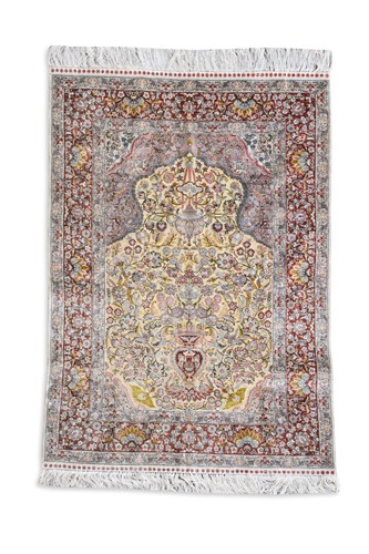 Lot 827 - A finely-woven silk and metal thread rug