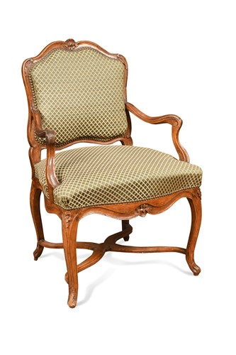 Lot 802 - A French Regence beech framed armchair