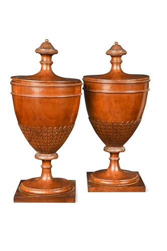 Lot 487 - A pair of George III style mahogany urns with covers