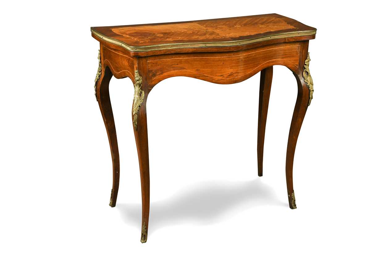 Lot 557 - A Louis XV style serpentine satinwood fold-over card table, 19th century
