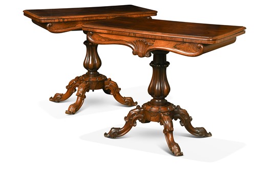 Lot 709 - A pair of Victorian carved rosewood tea tables
