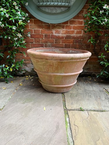 Lot 764 - A large terracotta circular planter, modern