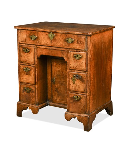 Lot 378 - A walnut kneehole desk, early 18th century