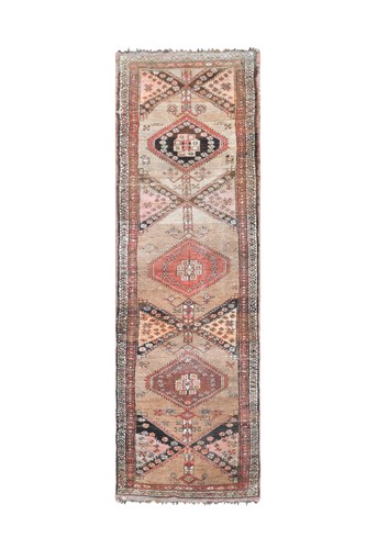 Lot 389 - An Afghan tribal runner rug, mid 20th century
