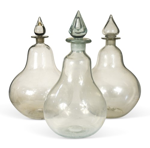 Lot 367 - Three large glass apothecary pharmacy jars and covers