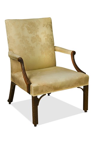 Lot 425 - A George III blind fret carved mahogany Gainsborough library armchair