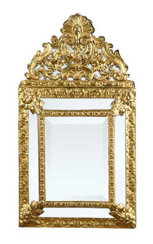 Lot 366 - A Dutch pressed brass, cushion-framed wall mirror, late 19th century