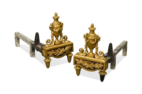 Lot 506 - A pair of French Louis XVI style ormolu chenets, early 20th century