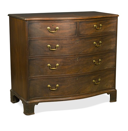 Lot 471 - A George III mahogany serpentine chest