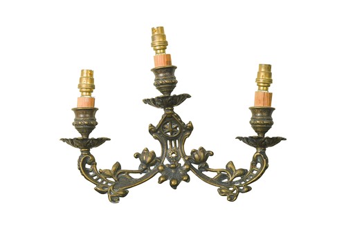 Lot 334 - A group of three cast bronze three light wall sconces, 20th century.